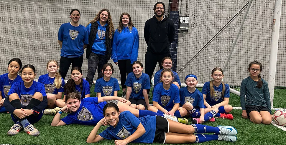 Naz and soccer team by goal